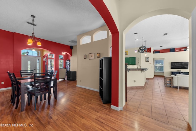 5266 Camelot Forest Dr, Jacksonville, FL 32258 - dining space featuring baseboards, wood finished floors, and a textured ceiling