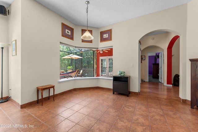 5266 Camelot Forest Dr, Jacksonville, FL 32258 - interior space featuring a textured ceiling, a ceiling fan, and tile patterned flooring