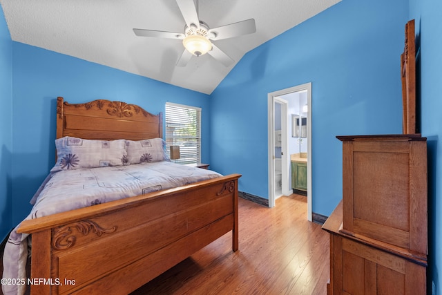 5266 Camelot Forest Dr, Jacksonville, FL 32258 - bedroom featuring ensuite bathroom, a ceiling fan, lofted ceiling, light wood finished floors, and baseboards