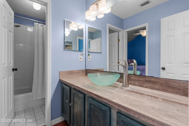 5266 Camelot Forest Dr, Jacksonville, FL 32258 - bathroom featuring a textured ceiling, vanity, tile patterned flooring, visible vents, and shower / bath combo