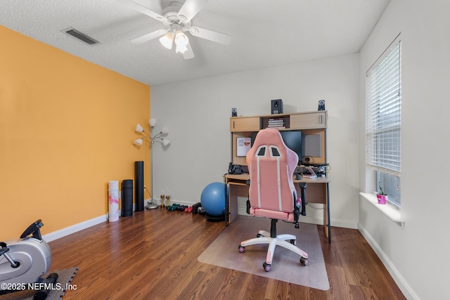 5266 Camelot Forest Dr, Jacksonville, FL 32258 - home office featuring wood finished floors, ceiling fan, baseboards, and visible vents