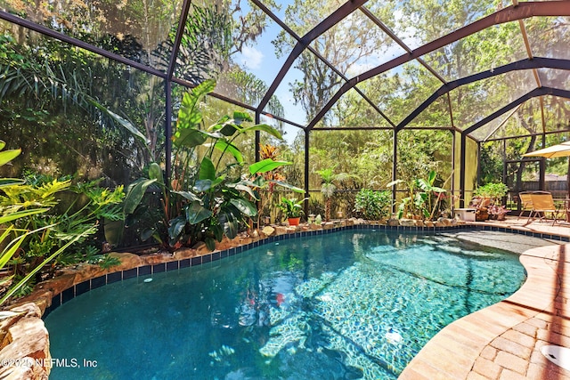 5266 Camelot Forest Dr, Jacksonville, FL 32258 - pool featuring a patio area and glass enclosure