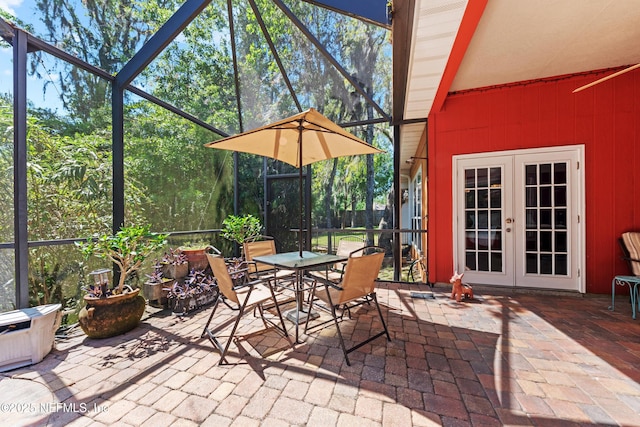 5266 Camelot Forest Dr, Jacksonville, FL 32258 - view of patio with outdoor dining space, french doors, and a lanai