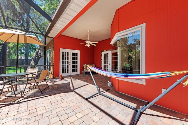 5266 Camelot Forest Dr, Jacksonville, FL 32258 - view of patio with a ceiling fan, fence, glass enclosure, outdoor dining area, and french doors
