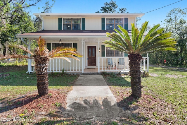 view of front facade with covered porch and a front lawn