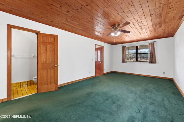carpeted spare room with wooden ceiling, baseboards, crown molding, and a ceiling fan