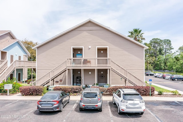 1601 Nectarine St Unit D5, Fernandina Beach, FL 32034 - view of front of house featuring uncovered parking and stairway