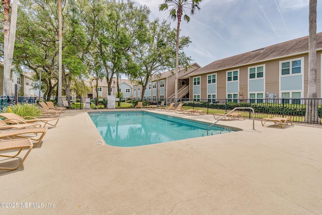 1601 Nectarine St Unit D5, Fernandina Beach, FL 32034 - community pool featuring fence, a residential view, and a patio
