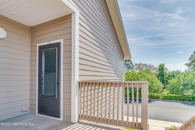 1601 Nectarine St Unit D5, Fernandina Beach, FL 32034 - view of exterior entry featuring a wooden deck