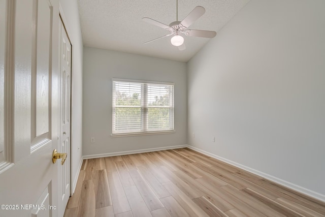 1601 Nectarine St Unit D5, Fernandina Beach, FL 32034 - spare room with light wood-type flooring, a textured ceiling, baseboards, and ceiling fan