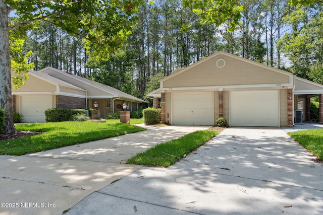 13706 Wm Davis Pkwy, Jacksonville, FL 32224 - view of front of property with brick siding, a garage, and a front lawn