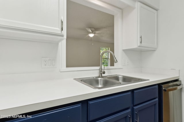13706 Wm Davis Pkwy, Jacksonville, FL 32224 - kitchen featuring blue cabinetry, stainless steel dishwasher, white cabinets, ceiling fan, and light countertops