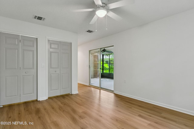 13706 Wm Davis Pkwy, Jacksonville, FL 32224 - unfurnished bedroom with light wood-style flooring, access to outside, and ceiling fan