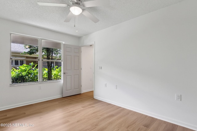 13706 Wm Davis Pkwy, Jacksonville, FL 32224 - unfurnished room with wood finished floors, a textured ceiling, and ceiling fan