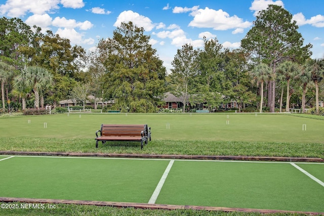 13706 Wm Davis Pkwy, Jacksonville, FL 32224 - view of property's community featuring an area to practice putting and view of wooded area