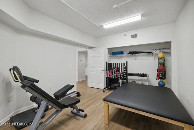 13706 Wm Davis Pkwy, Jacksonville, FL 32224 - workout area featuring wood finished floors and baseboards