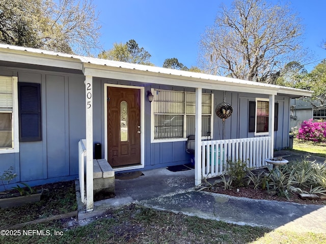 205 Harbor Dr, Palatka, FL 32177 - entrance to property with a porch and board and batten siding