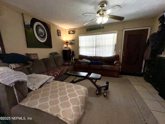 205 Harbor Dr, Palatka, FL 32177 - living area featuring tile patterned floors, a textured ceiling, and ceiling fan