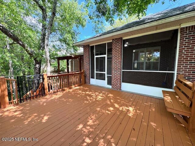 2924 Captiva Bluff Rd S, Jacksonville, FL 32226 - wooden deck with a sunroom