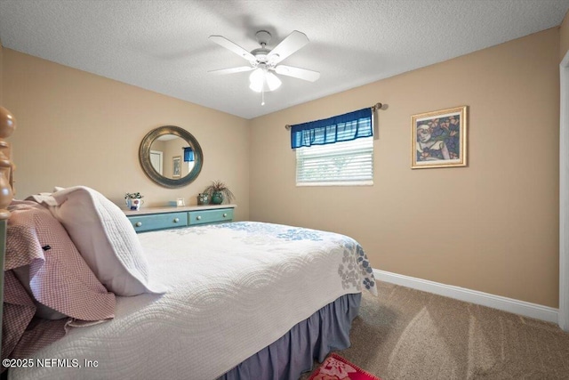 carpeted bedroom featuring ceiling fan, a textured ceiling, and baseboards