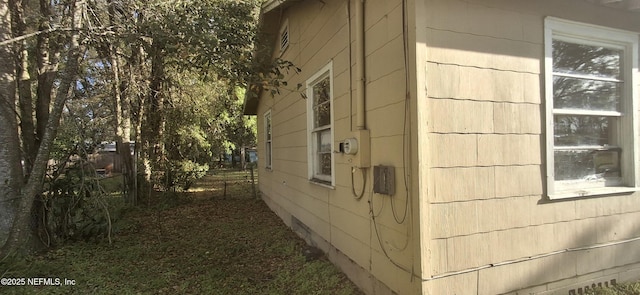view of home's exterior featuring fence