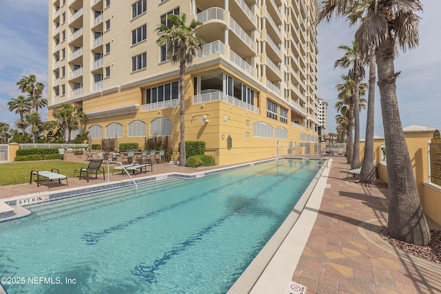 pool featuring a patio area