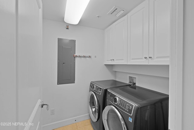clothes washing area with cabinet space, electric panel, baseboards, visible vents, and washer and clothes dryer