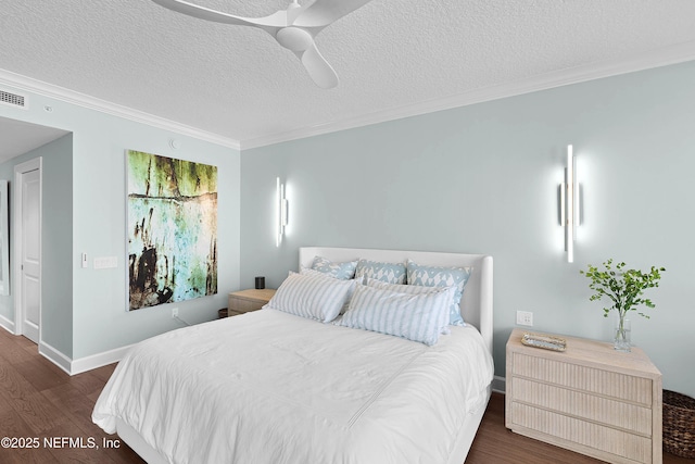 bedroom featuring ornamental molding, a textured ceiling, baseboards, and dark wood-type flooring