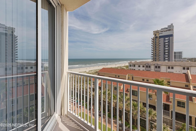 balcony with a view of the beach and a water view