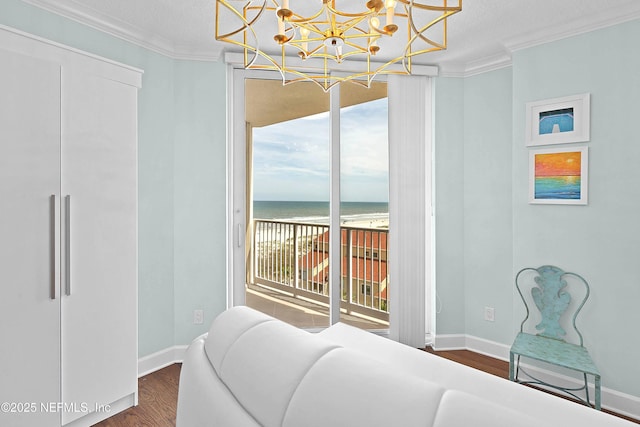 bedroom with a chandelier, crown molding, access to outside, and dark wood finished floors