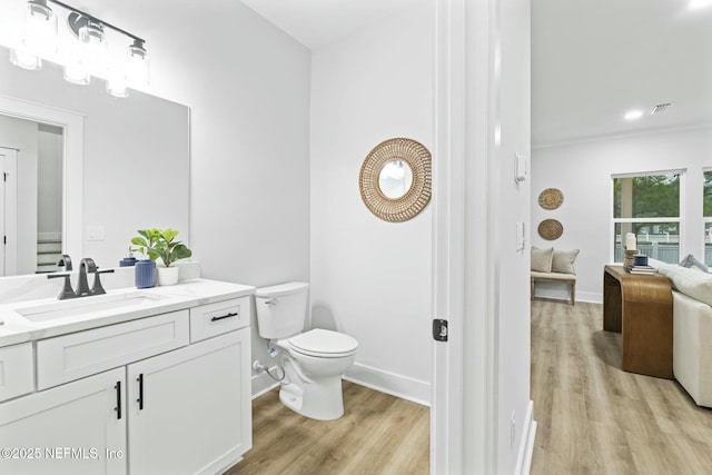 85199 Southern Creek Blvd, Fernandina Beach, FL 32034 - bathroom featuring toilet, baseboards, visible vents, and wood finished floors