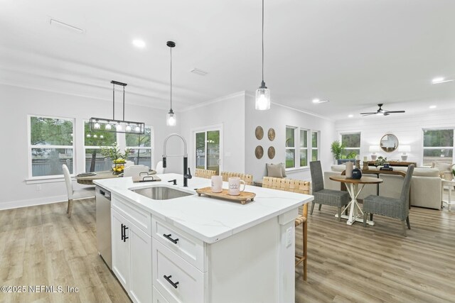 85199 Southern Creek Blvd, Fernandina Beach, FL 32034 - kitchen with dishwasher, a sink, open floor plan, recessed lighting, and white cabinetry