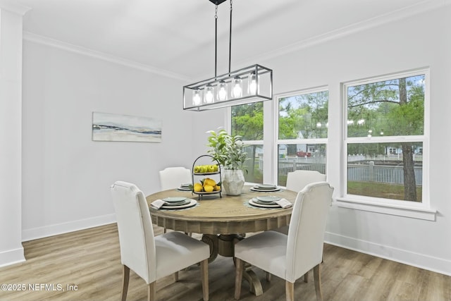 85199 Southern Creek Blvd, Fernandina Beach, FL 32034 - dining space with light wood-style floors, baseboards, and ornamental molding