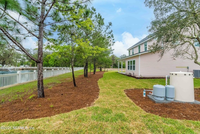 85199 Southern Creek Blvd, Fernandina Beach, FL 32034 - view of yard featuring central AC and fence