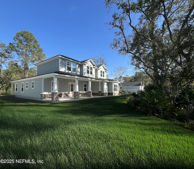 85084 Southern Creek Blvd, Fernandina Beach, FL 32034 - exterior space featuring covered porch and a lawn