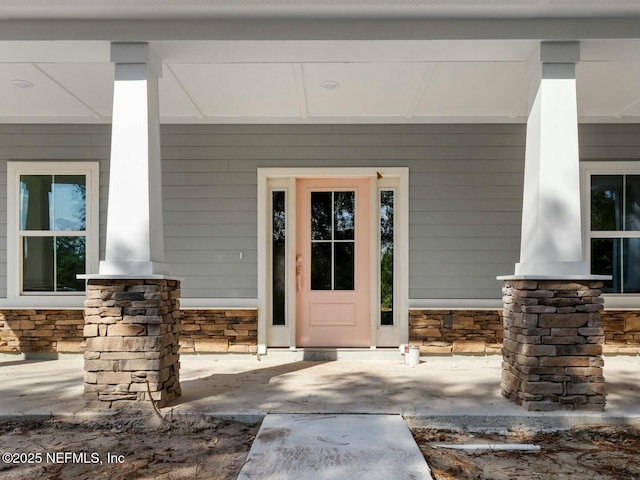 85084 Southern Creek Blvd, Fernandina Beach, FL 32034 - property entrance featuring a porch and stone siding