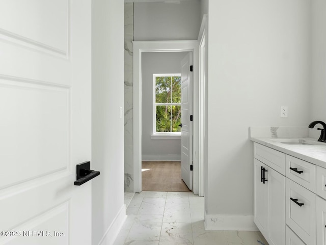85084 Southern Creek Blvd, Fernandina Beach, FL 32034 - bathroom featuring baseboards, marble finish floor, and vanity