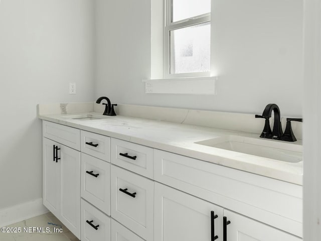 85084 Southern Creek Blvd, Fernandina Beach, FL 32034 - bathroom with a sink, baseboards, and double vanity
