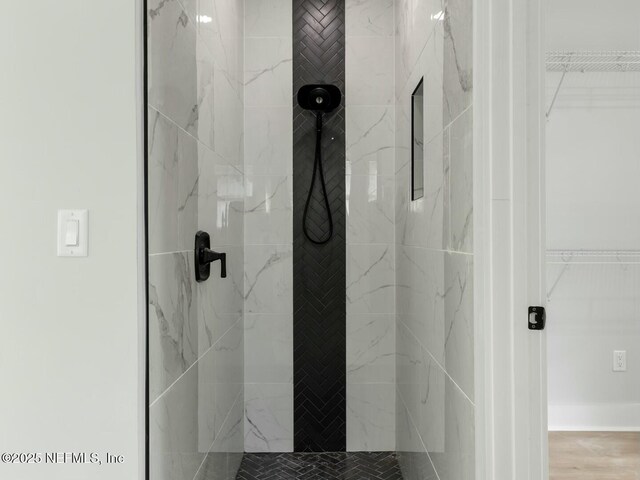 85084 Southern Creek Blvd, Fernandina Beach, FL 32034 - bathroom with a walk in closet and a stall shower