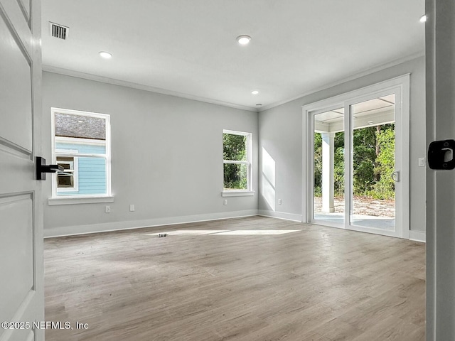 85084 Southern Creek Blvd, Fernandina Beach, FL 32034 - unfurnished room with crown molding, baseboards, visible vents, and wood finished floors
