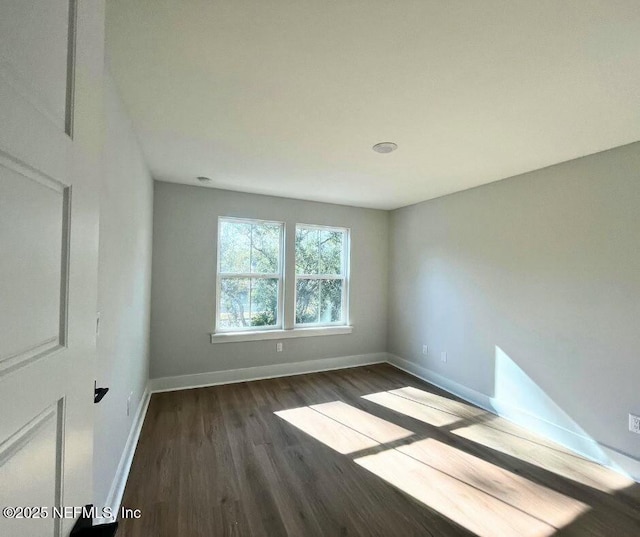 85084 Southern Creek Blvd, Fernandina Beach, FL 32034 - empty room with baseboards and dark wood-type flooring