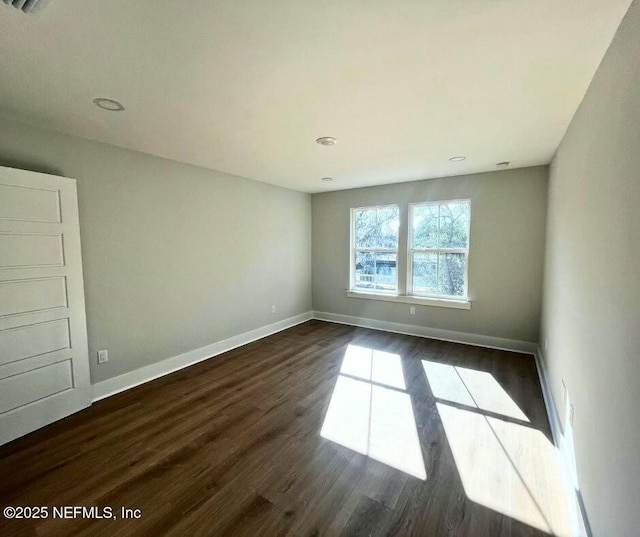 85084 Southern Creek Blvd, Fernandina Beach, FL 32034 - empty room with baseboards and dark wood finished floors