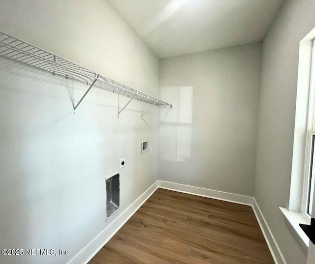 85084 Southern Creek Blvd, Fernandina Beach, FL 32034 - washroom with laundry area, baseboards, hookup for a washing machine, dark wood-style floors, and electric dryer hookup