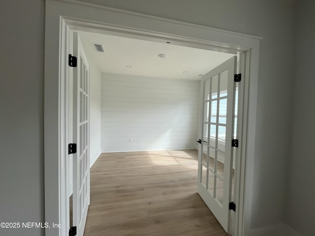 85118 Southern Creek Blvd, Fernandina Beach, FL 32034 - hallway with baseboards, french doors, wood finished floors, and visible vents