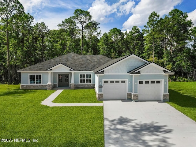 85118 Southern Creek Blvd, Fernandina Beach, FL 32034 - view of front facade featuring french doors, a front lawn, stone siding, and a garage