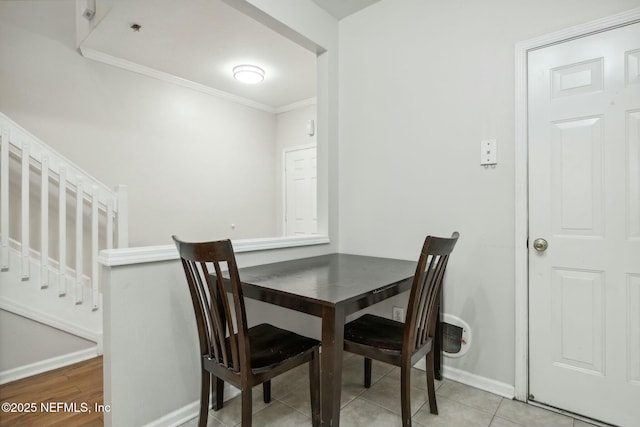 7990 Baymeadows Rd E Unit 2202, Jacksonville, FL 32256 - dining room featuring baseboards, crown molding, and stairs