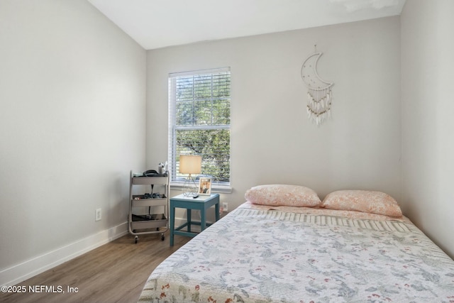 7990 Baymeadows Rd E Unit 2202, Jacksonville, FL 32256 - bedroom with wood finished floors and baseboards