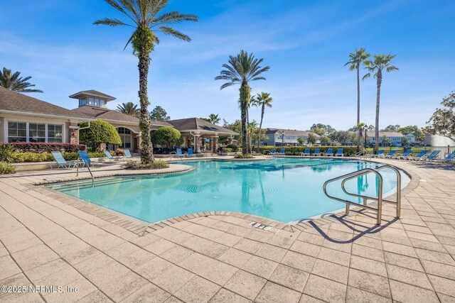 7990 Baymeadows Rd E Unit 2202, Jacksonville, FL 32256 - community pool with a patio area