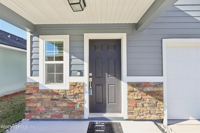 entrance to property with stone siding