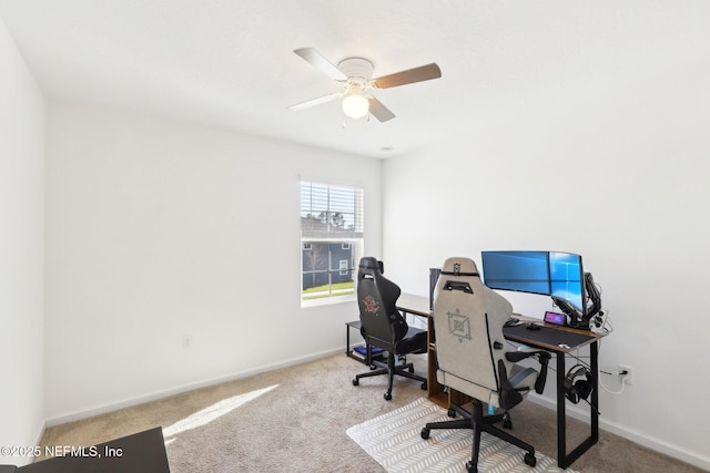 office space with baseboards, a ceiling fan, and carpet floors
